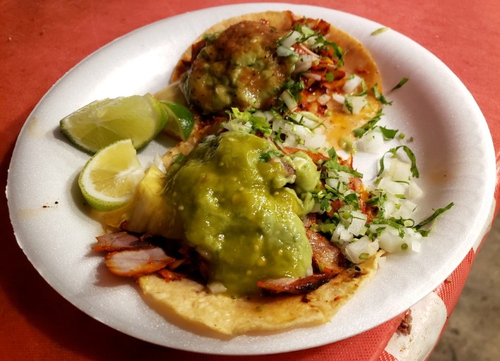 2 tacos al pastor with salsa and guacamole at Angel's Tijuana Tacos.