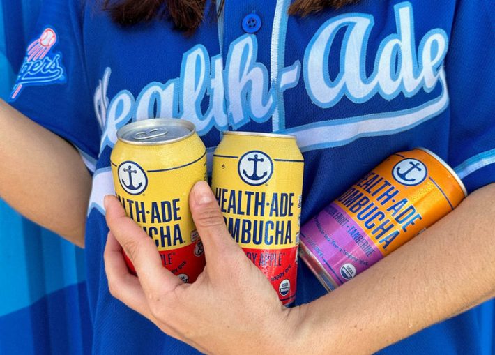 An armful of Health-Ade Kombucha.