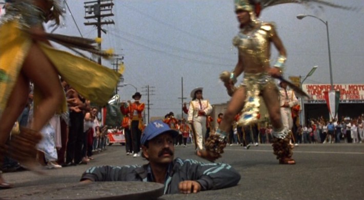 Rudy emerges from the manhole. Photo via Universal Pictures.