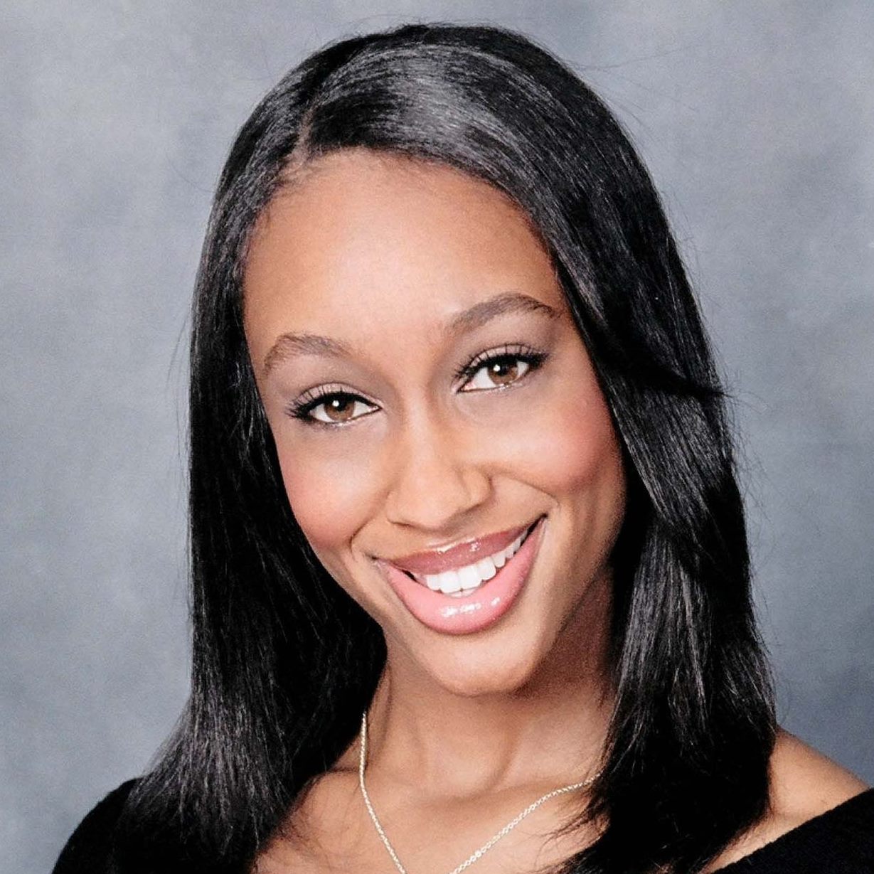 A photograph of Mitrice Richardson wutg a blue background