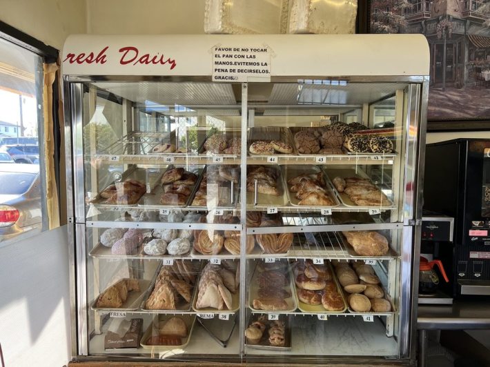 The pan dulce racks at Panadería Oaxaca. Photo via Michael R./Yelp.