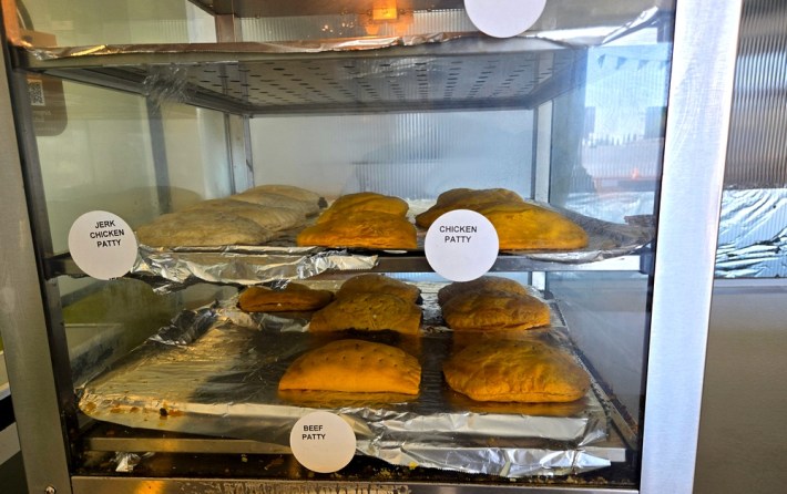 Jamaican patties in a heated case at Jerk Stop