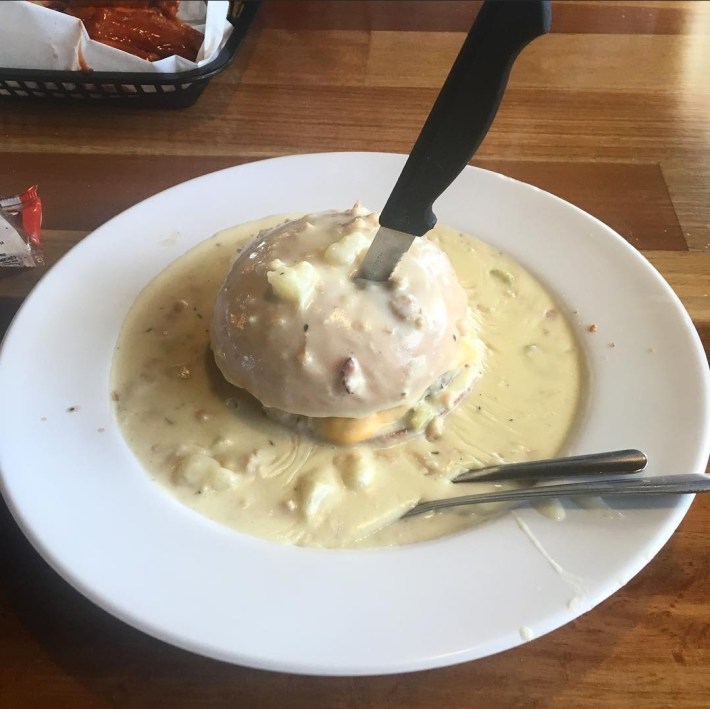 A chowder-smothered cheeseburger at Chowder Barge