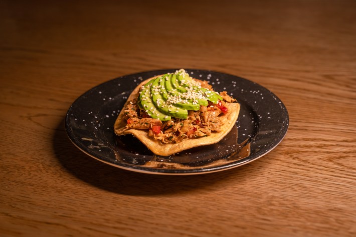 Tuna salad with corn tostada, pan-seared tuna, pico de gallo, bell pepper, sesame seed, and avocado.